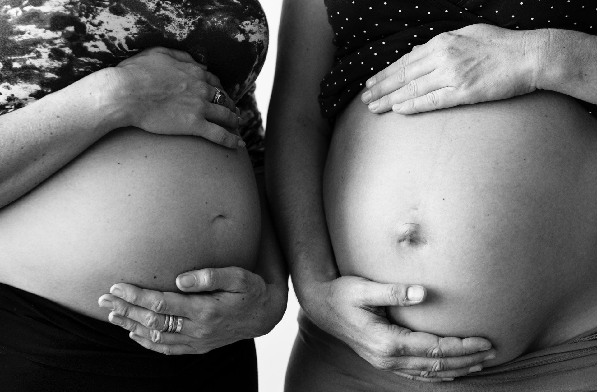 Pregnant Ladies holding baby bump 